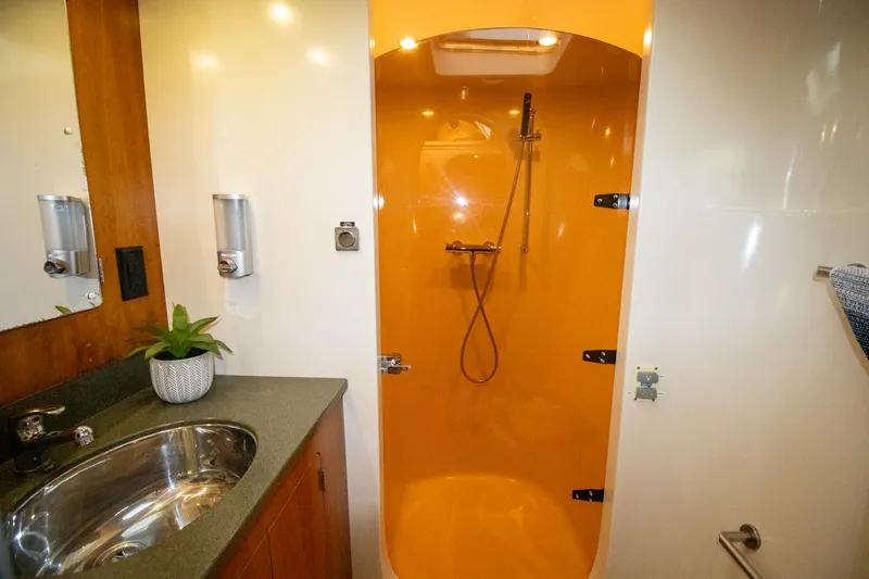 Slide: The Image of Luxurious bathroom in 2004 Antares PDQ 44 yacht with modern shower and sink. - 32