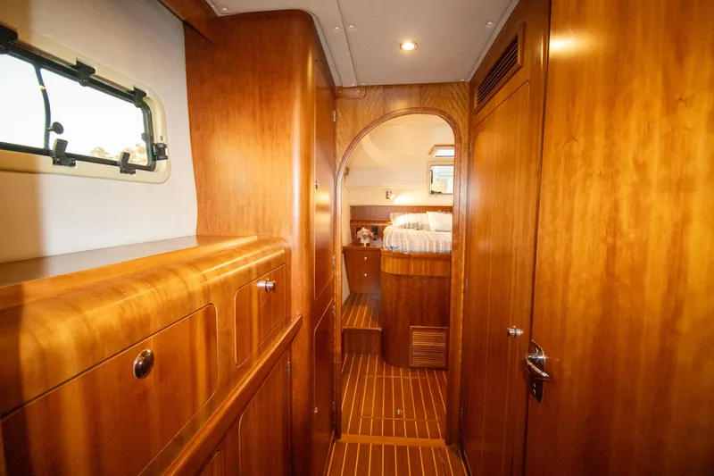 Slide: The Image of Interior of 2004 Antares PDQ 44 yacht with wooden paneling and cozy cabin. - 35