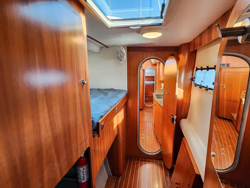 Slide: The Image of Luxurious wooden interior of 2004 Antares PDQ 44 yacht cabin with skylight. - 46