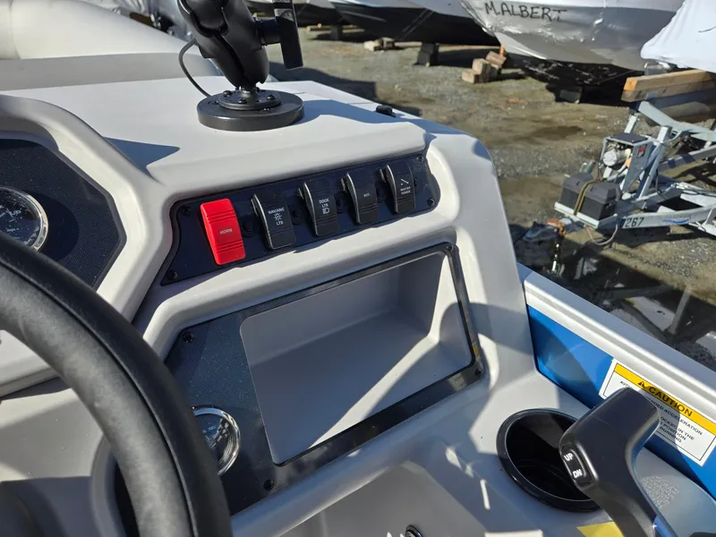 Slide: The Image of 2025 Godfrey Xperience Cruise 2086 CX dashboard with controls and steering wheel. - 17