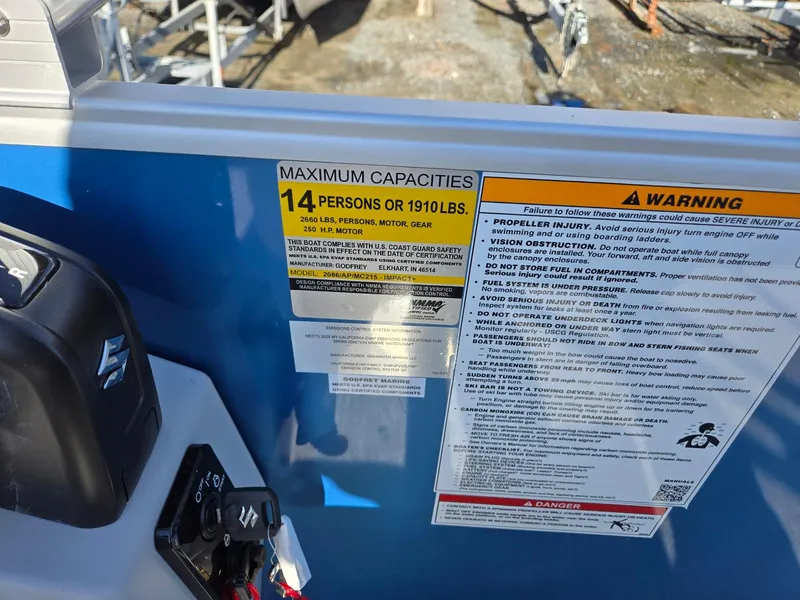 Slide: The Image of Capacity warning label on 2025 Godfrey Xperience Cruise 2086 CX boat. - 18