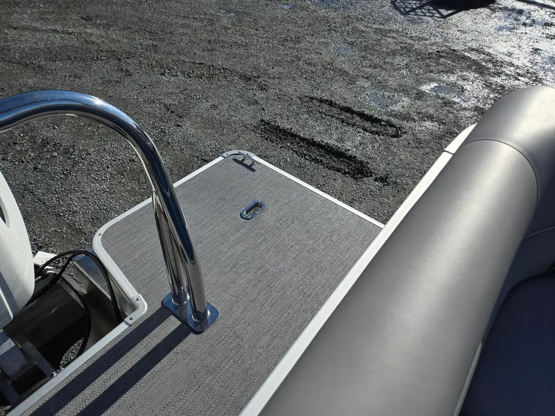 Slide: The Image of 2025 Godfrey Xperience Cruise 2086 CX boat deck with railing and seating. - 24