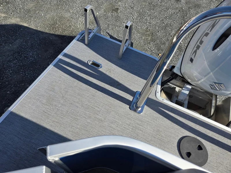 Slide: The Image of 2025 Godfrey Xperience Cruise 2086 CX boat deck with motor and ladder. - 25