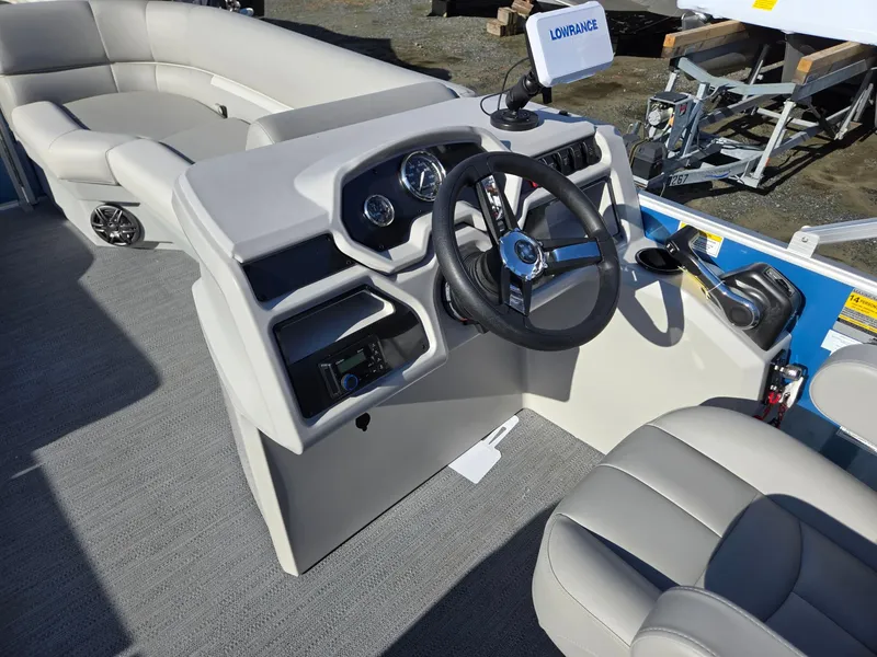 Slide: The Image of 2025 Godfrey Xperience Cruise 2086 CX boat interior with steering console and seating. - 30