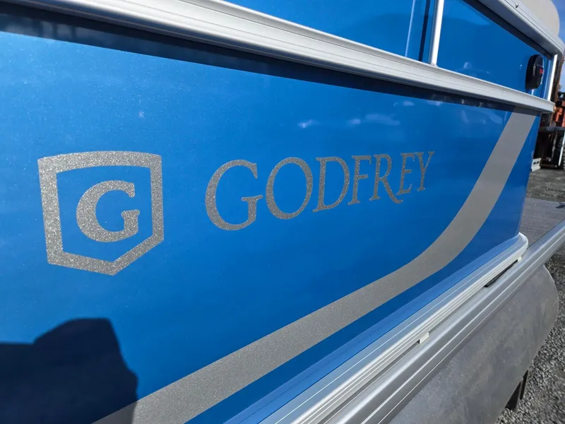 Slide: The Image of Close-up of 2025 Godfrey Xperience Cruise 2086 CX boat with blue exterior. - 35