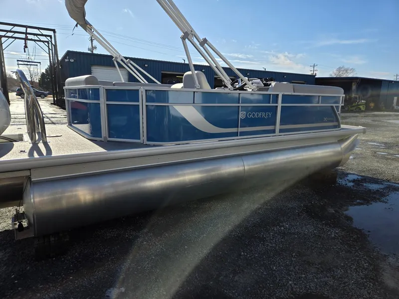 Slide: The Image of 2025 Godfrey Xperience Cruise 2086 CX pontoon boat in a parking lot. - 6