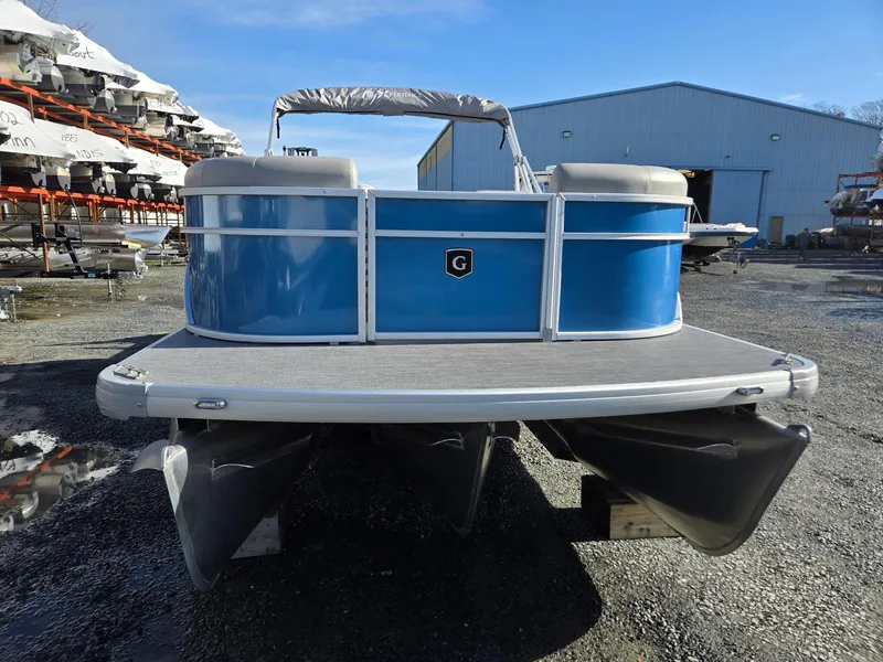 Slide: The Image of 2025 Godfrey Xperience Cruise 2086 CX pontoon boat in a storage yard. - 8
