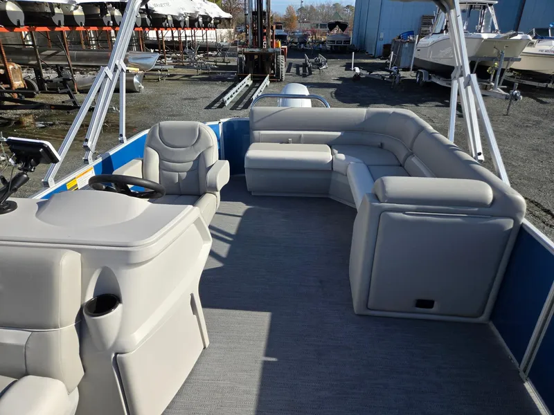 Slide: The Image of 2025 Godfrey Xperience Cruise 2086 CX pontoon boat interior with plush seating. - 9