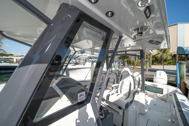 Slide: The Image of 2022 World Cat 400 CC-X boat interior with modern seating and sleek design. - 16