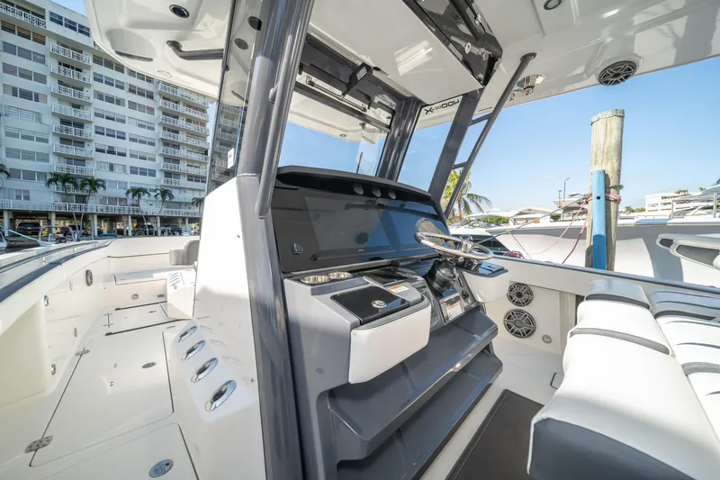 Slide: The Image of Interior of 2022 World Cat 400 CC-X boat with modern helm and seating. - 17