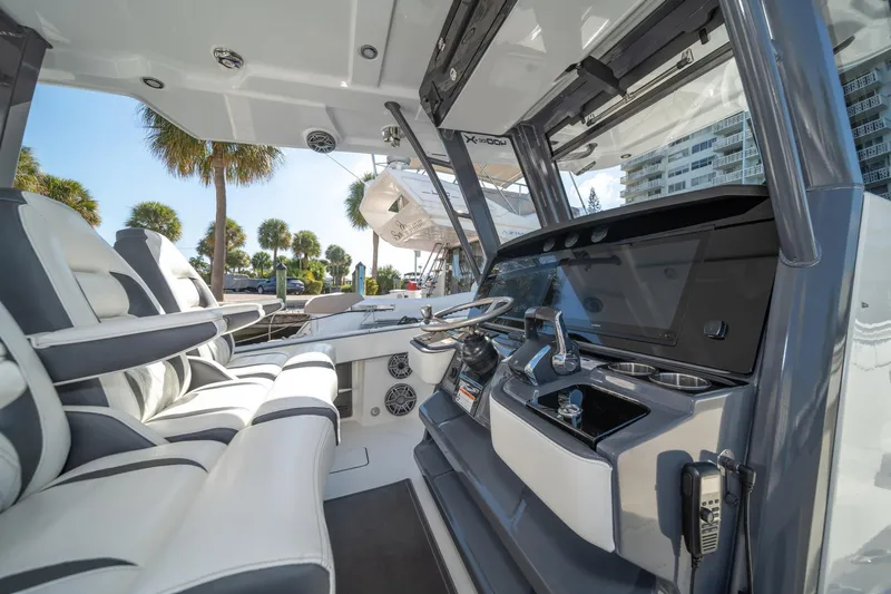 Slide: The Image of Interior of 2022 World Cat 400 CC-X boat with modern helm and seating. - 19