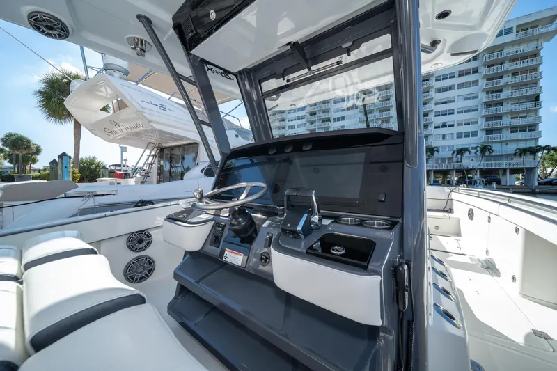 Slide: The Image of 2022 World Cat 400 CC-X boat cockpit with modern controls and seating. - 20