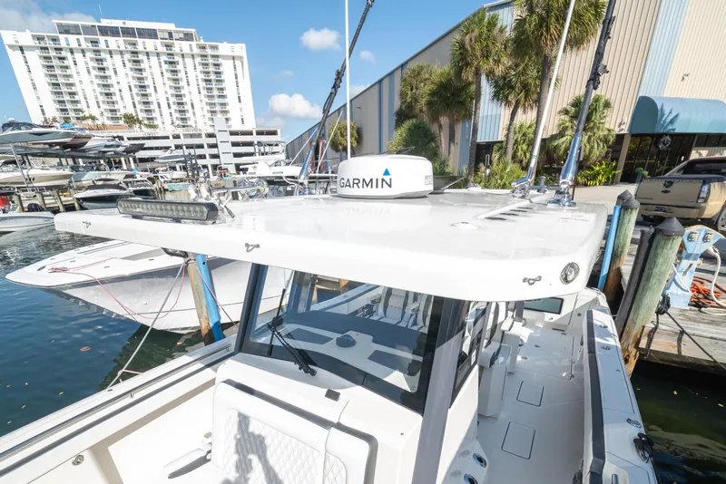 Slide: The Image of 2022 World Cat 400 CC-X boat docked at marina with Garmin equipment. - 7