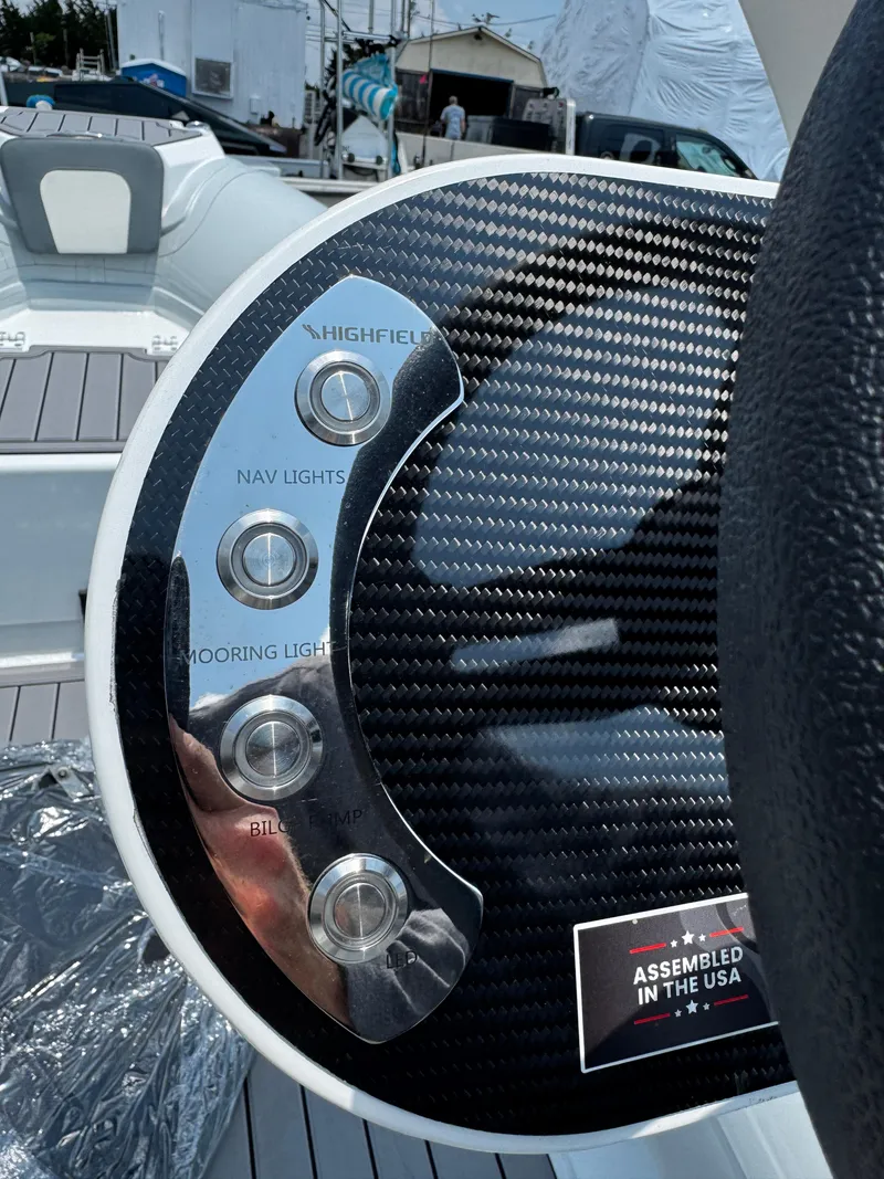 Slide: The Image of Control panel of 2025 Highfield Classic 400 boat with navigation and mooring light buttons. - 10
