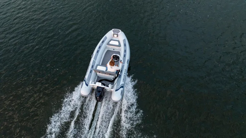 Slide: The Image of Highfield Classic 400 boat cruising on water, aerial view, 2025 model. - 8