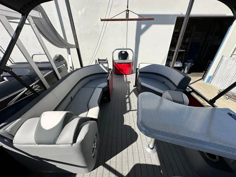 Slide: The Image of 2025 Tahoe Pontoon 2585 LTZ Entertainer interior with seating and table. - 10