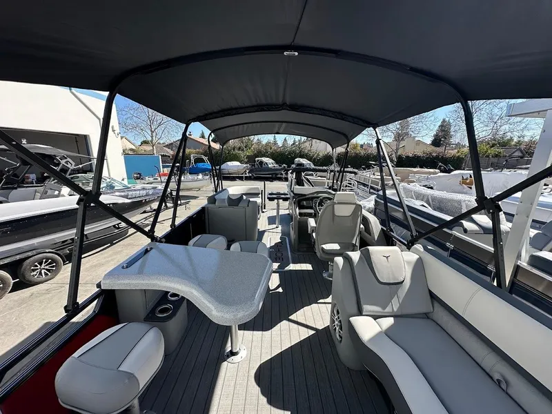 Slide: The Image of 2025 Tahoe Pontoon 2585 LTZ Entertainer with spacious seating and canopy. - 19