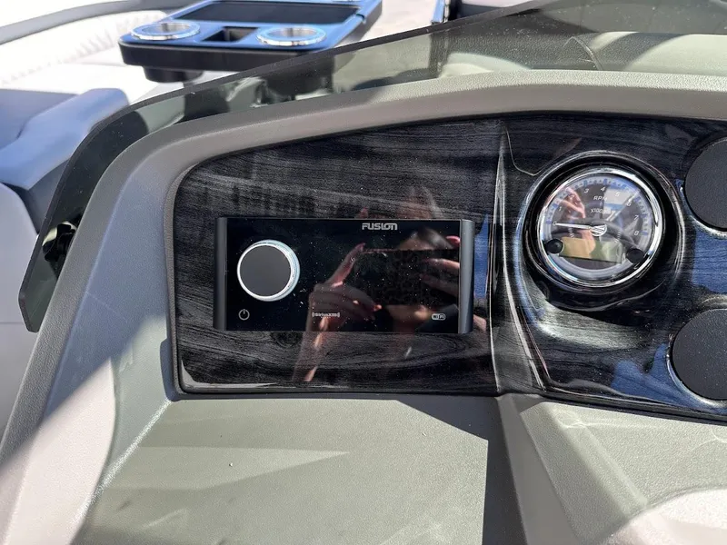 Slide: The Image of Dashboard of 2025 Tahoe Pontoon 2585 LTZ Entertainer with Fusion stereo system. - 24