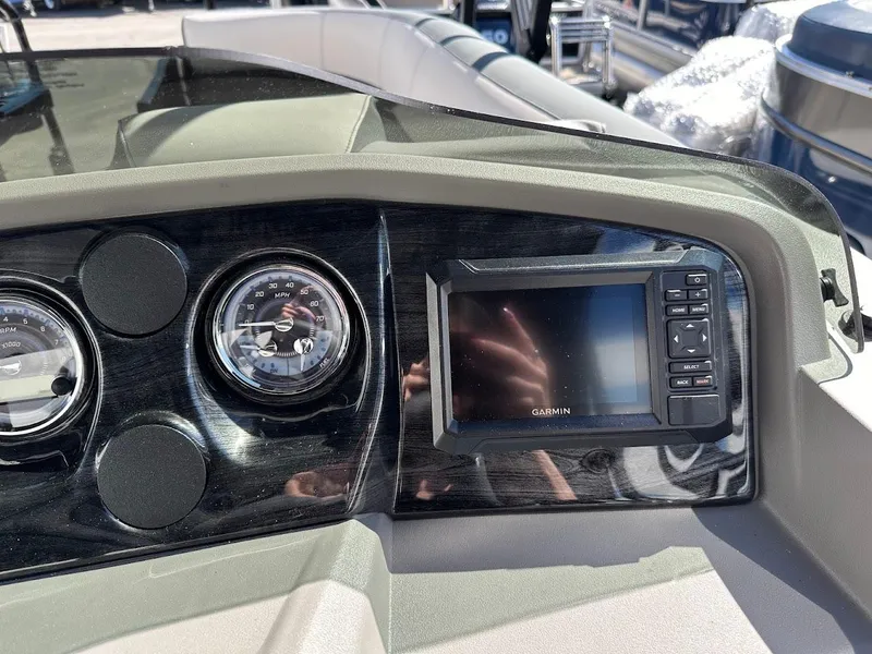 Slide: The Image of Dashboard of 2025 Tahoe Pontoon 2585 LTZ Entertainer with Garmin display and gauges. - 25