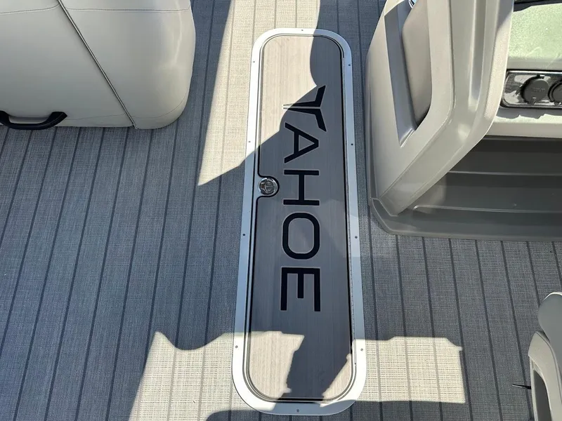 Slide: The Image of 2025 Tahoe Pontoon 2585 LTZ Entertainer deck with logo, featuring sleek design. - 28