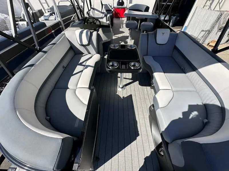Slide: The Image of 2025 Tahoe Pontoon 2585 LTZ Entertainer with spacious seating and modern interior design. - 4