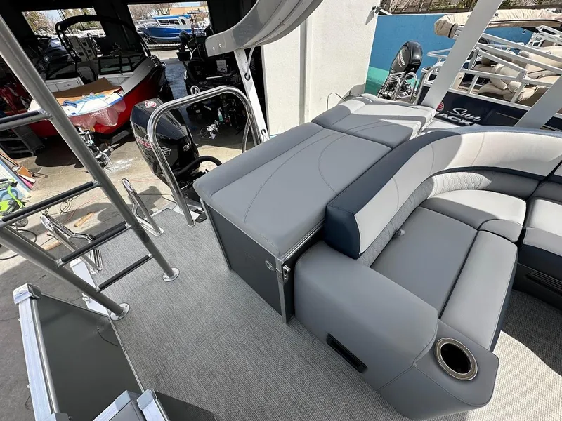 Slide: The Image of 2025 Tahoe Pontoon Cascade Cruise Funship interior with gray seating and ladder. - 15