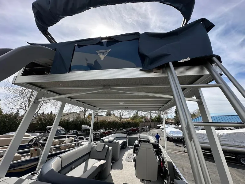 Slide: The Image of 2025 Tahoe Pontoon Cascade Cruise Funship with upper deck and slide, parked outdoors. - 18