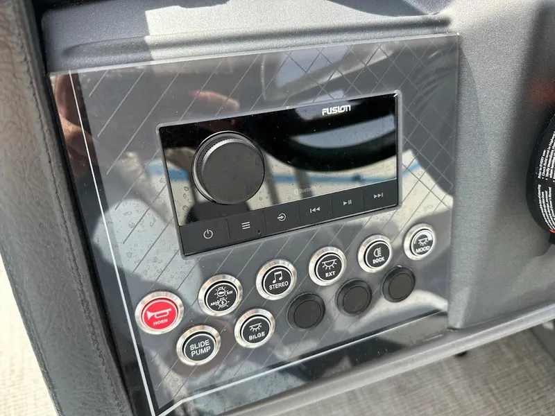 Slide: The Image of Control panel of 2025 Tahoe Pontoon Cascade Cruise Funship with audio system and buttons. - 23