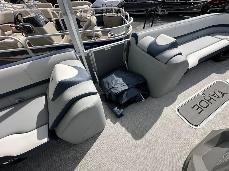 Slide: The Image of 2025 Tahoe Pontoon Cascade Cruise Funship interior with plush seating and spacious layout. - 28