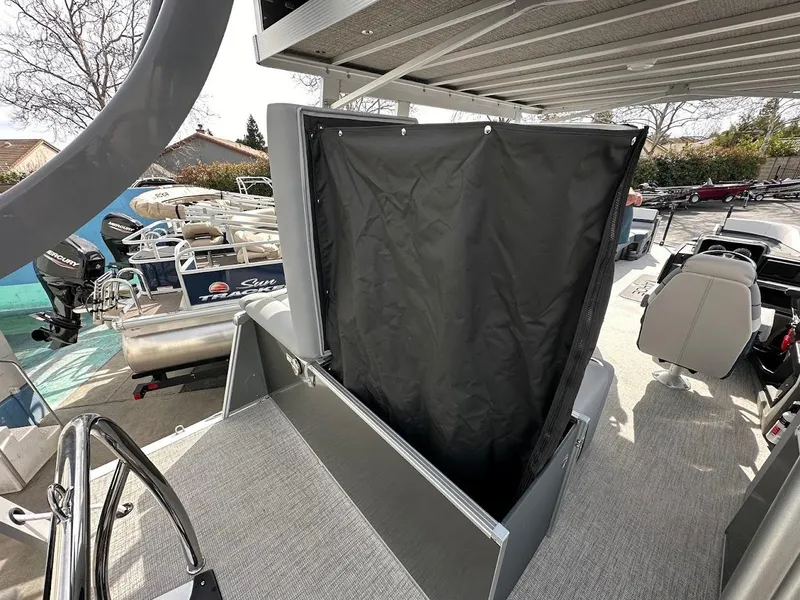 Slide: The Image of 2025 Tahoe Pontoon Cascade Cruise Funship interior with seating and covered area. - 35