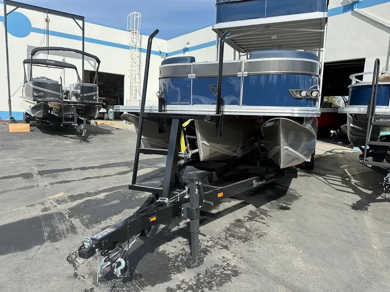 Slide: The Image of 2025 Tahoe Pontoon Cascade Cruise Funship on trailer in outdoor lot. - 4