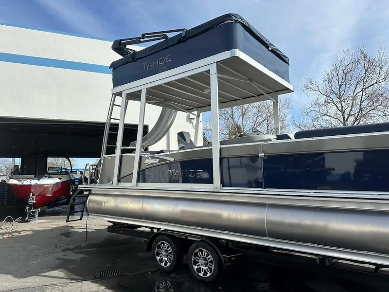 Slide: The Image of 2025 Tahoe Pontoon Cascade Cruise Funship on trailer, featuring upper deck and slide. - 6