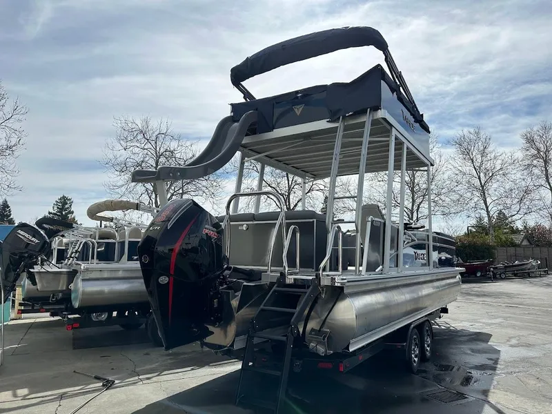 Slide: The Image of 2025 Tahoe Pontoon Cascade Cruise Funship with slide, parked outdoors on a sunny day. - 8