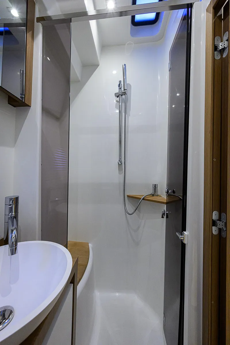 Slide: The Image of 2017 Beneteau Gran Turismo 49 Fly yacht bathroom with modern shower and sink. - 18