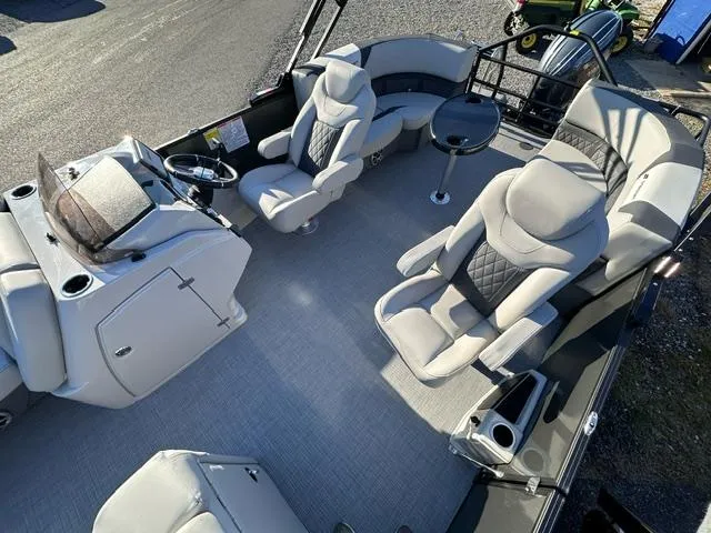 Slide: The Image of 2025 Starcraft SLS 1 boat interior with plush seating and modern helm. - 2