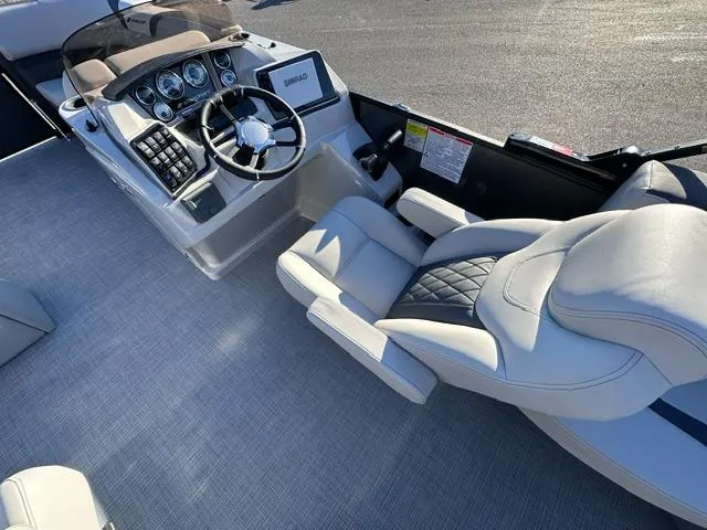 Slide: The Image of 2025 Starcraft SLS 1 boat interior with modern steering and plush seating. - 3