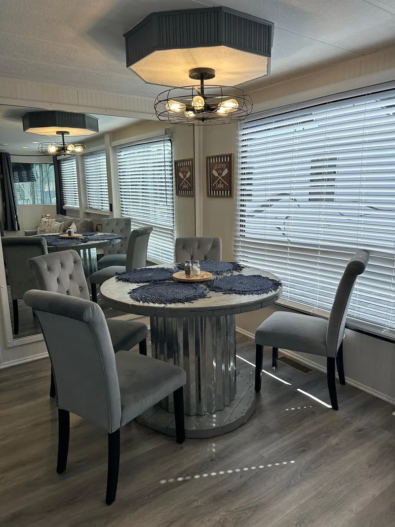 Slide: The Image of Dining area in a 1995 Lakeview model, featuring modern decor and elegant seating. - 6