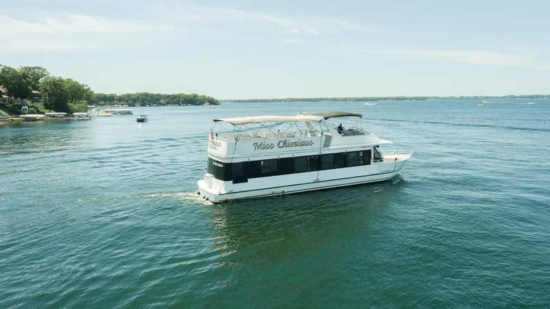 Slide: The Image of Interior of a 1994 Skipperliner 5800 boat with seating and a small bar area. - 13