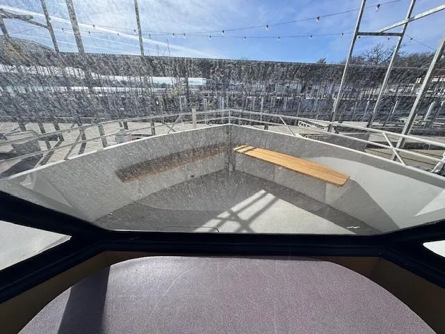 Slide: The Image of 1994 Skipperliner 5800 cruising on a serene lake under a clear sky. - 15