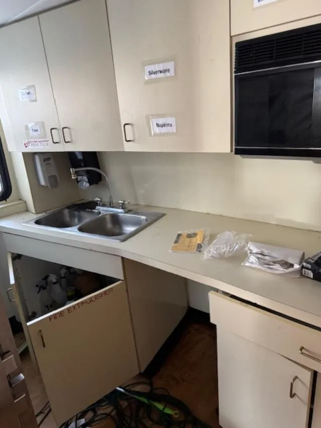 Slide: The Image of Interior of 1994 Skipperliner 5800 with star-patterned carpet and panoramic windows. - 18