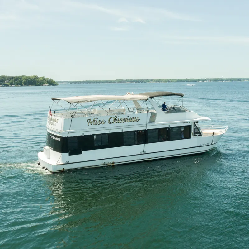 Slide: The Image of Interior of 1994 Skipperliner 5800 with wood paneling and kitchen area. - 21