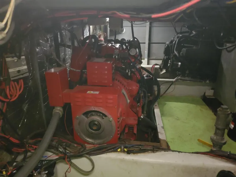 Slide: The Image of Upper deck of a 1994 Skipperliner 5800 with tables and chairs, docked at a marina. - 6