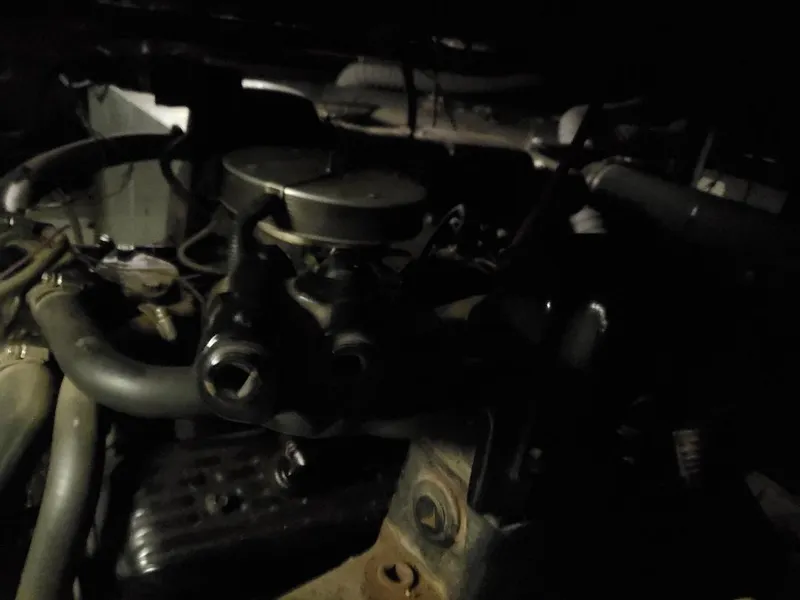 Slide: The Image of Engine room of a 1994 Skipperliner 5800 with visible machinery and wiring. - 7