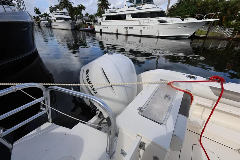 Slide: The Image of 2020 World Cat 325 CC boat docked with Yamaha outboard engine. - 20