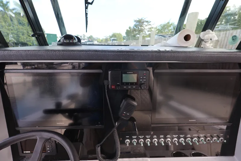 Slide: The Image of 2020 World Cat 325 CC dashboard with dual screens and control panel. - 22