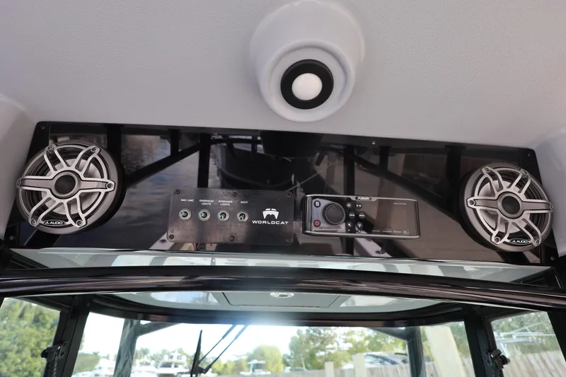 Slide: The Image of World Cat 325 CC 2020 boat audio system with speakers and control panel. - 23