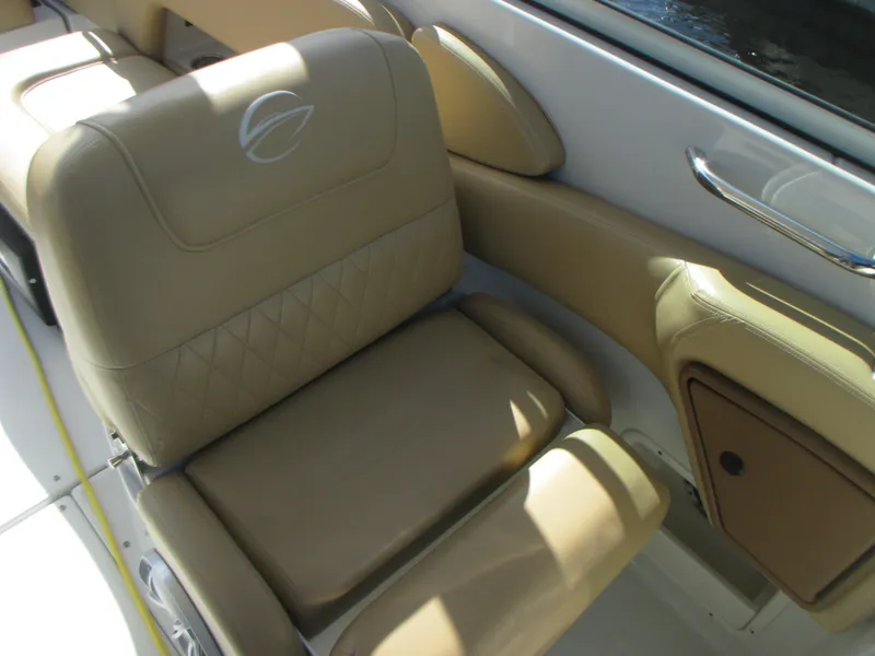 Slide: The Image of 2018 Crownline Eclipse E29 XS boat seat with tan upholstery and elegant design. - 13