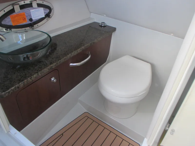 Slide: The Image of 2018 Crownline Eclipse E29 XS boat bathroom with modern sink and toilet. - 23