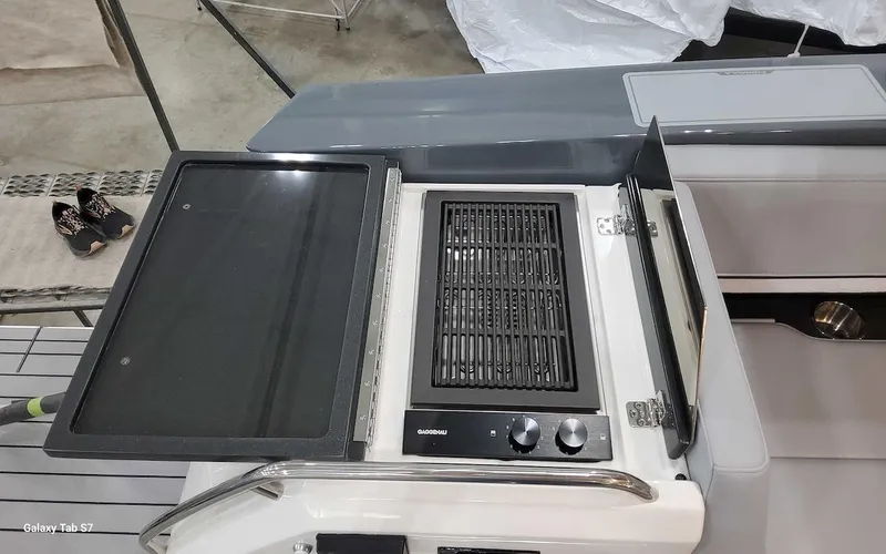 Slide: The Image of 2024 Formula 430 Super Sport Crossover outdoor grill and prep area. - 17