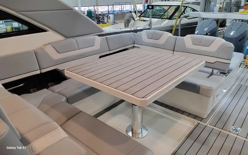 Slide: The Image of 2024 Formula 430 Super Sport Crossover luxury seating area with table. - 20